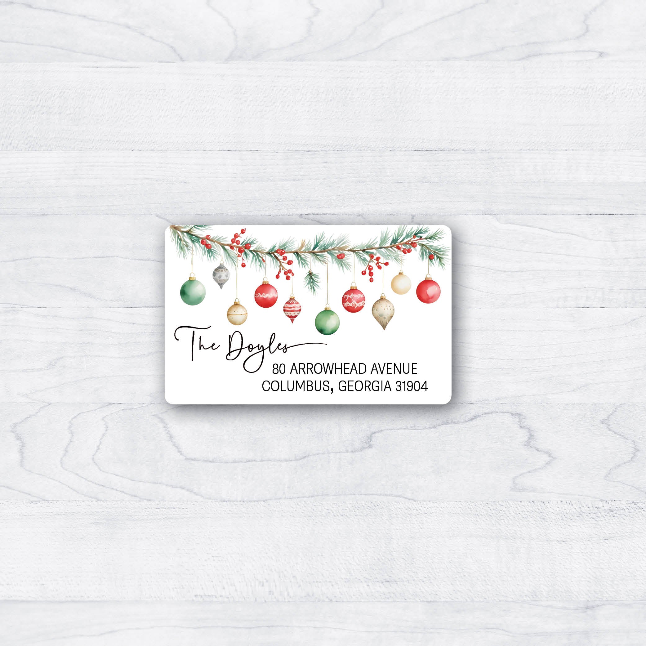 return address labels with red and green accents of holly, ornaments, script font for a decorative look
