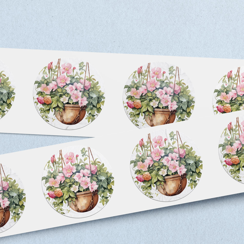 envelope seals with a hanging basket brimming with pink impatiens. 
